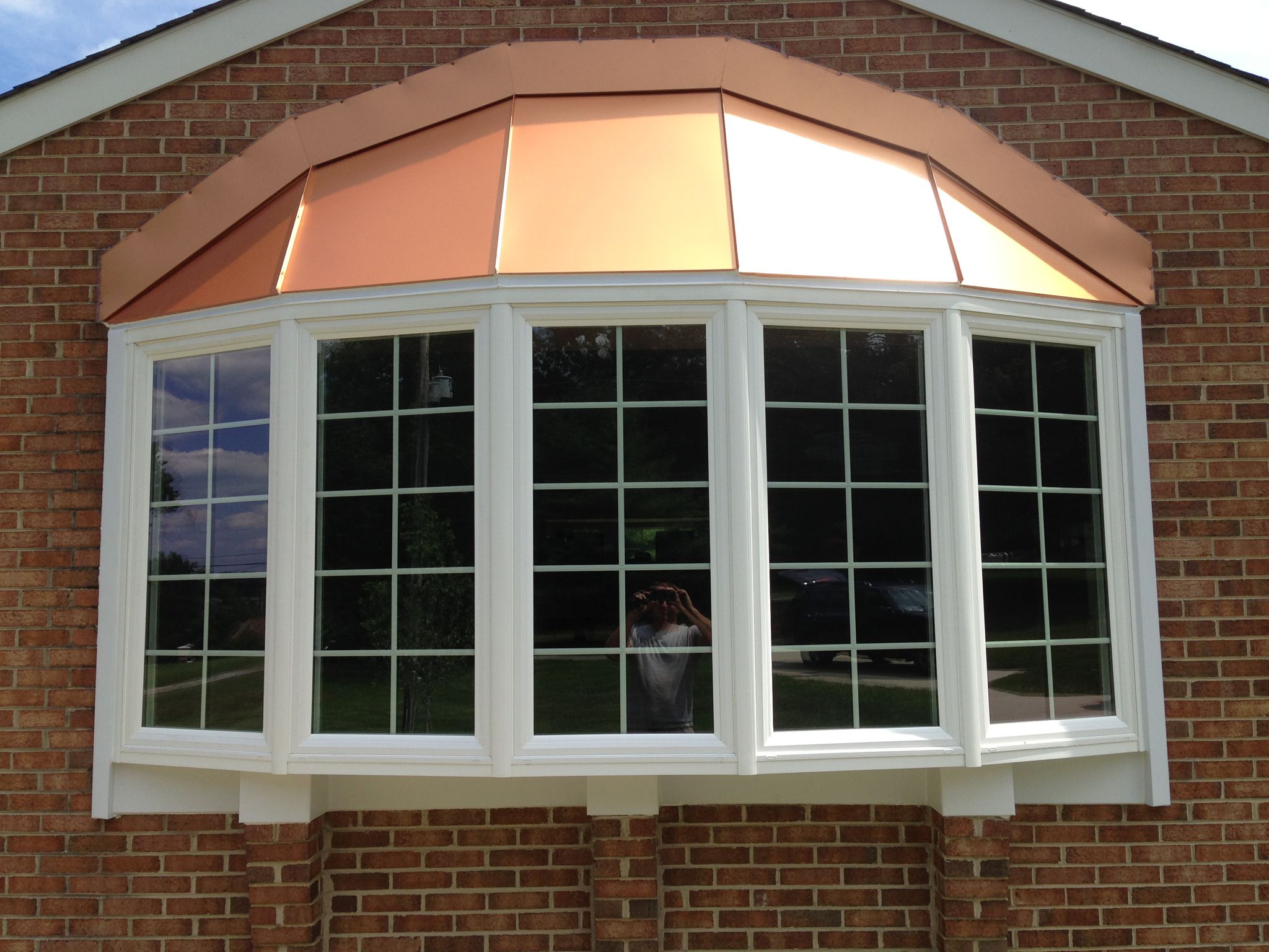 Bay window installation with copper roof detail